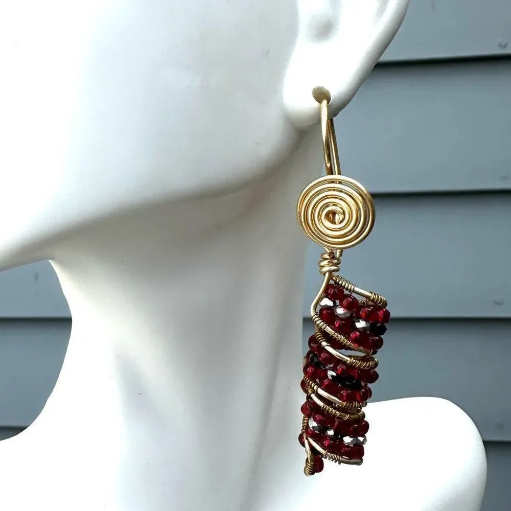 Red beaded gold tone drop earrings